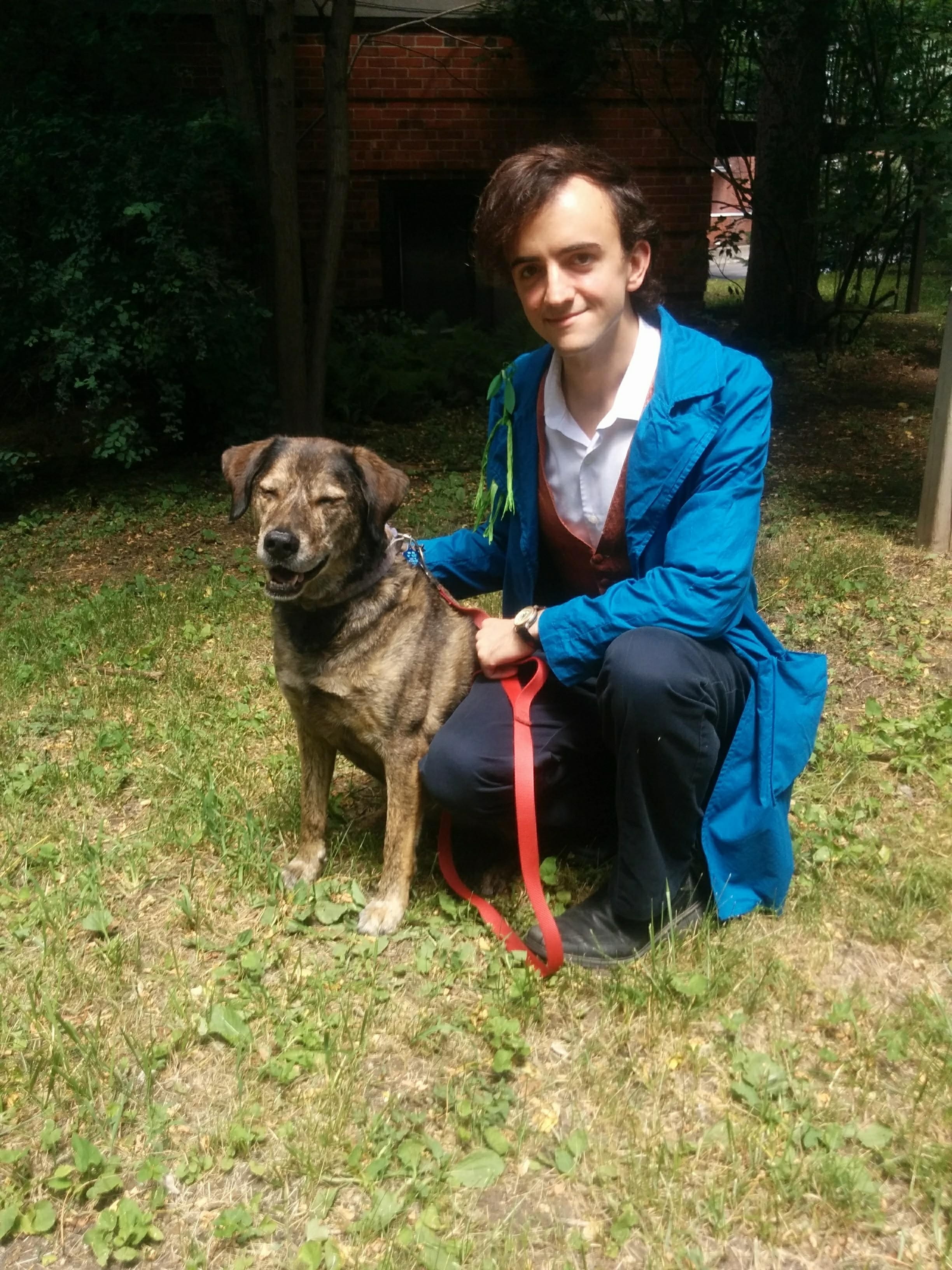Me, dressed as Newt Scamander from Fantastic Beasts and Where to Find Them, accompanied by a dog named Bo who is a Good Boy