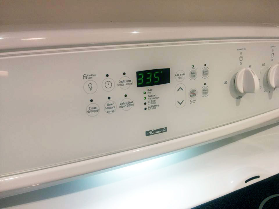 An oven, showing 335°F on the display